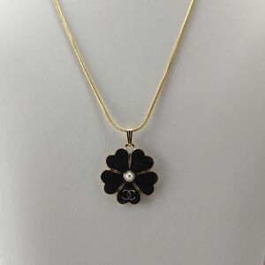 Authentic Chanel Black and Gold Flower Pendant Stamped 18 Karat Gold Necklace